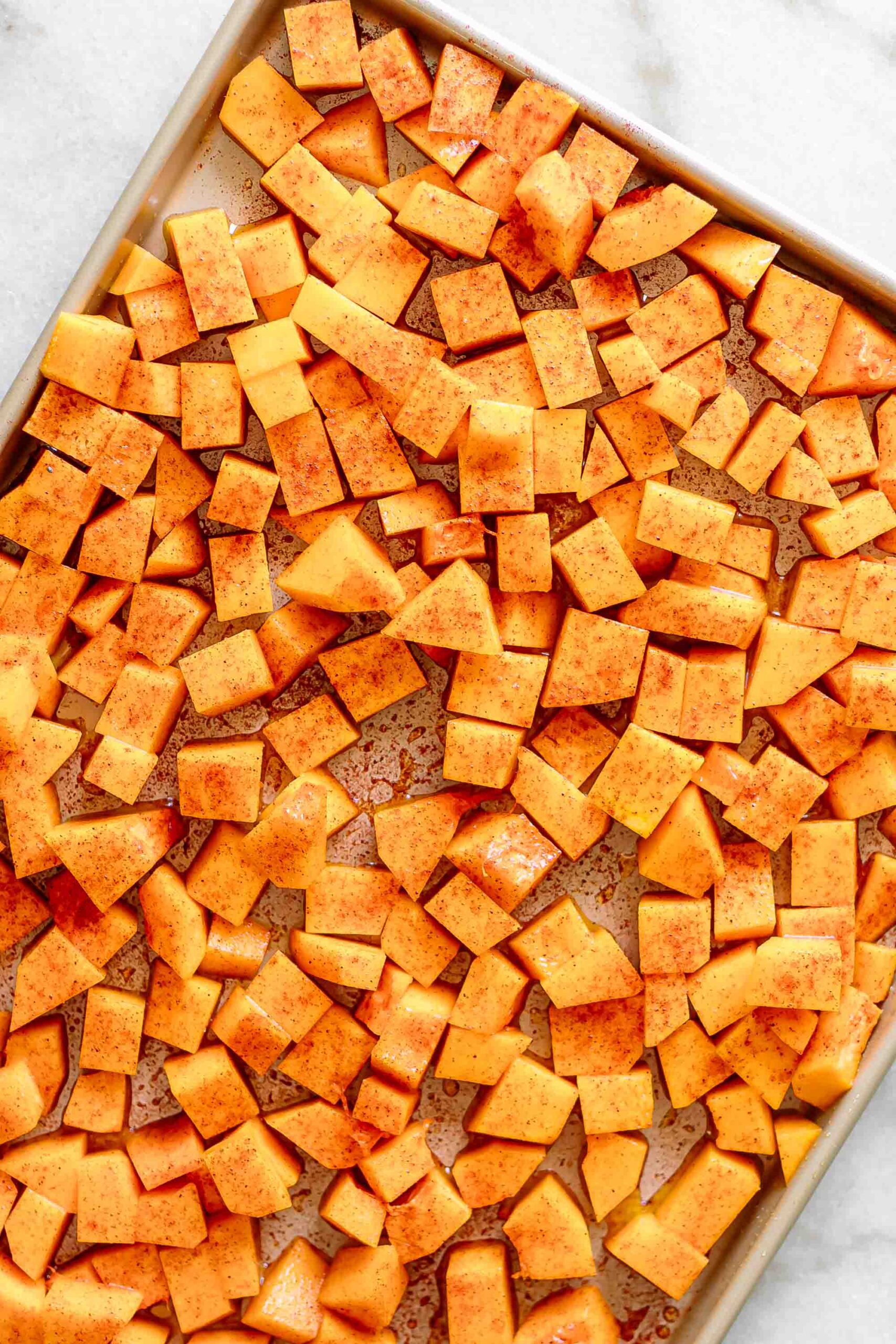 butternut squash on a sheet pan before roasting