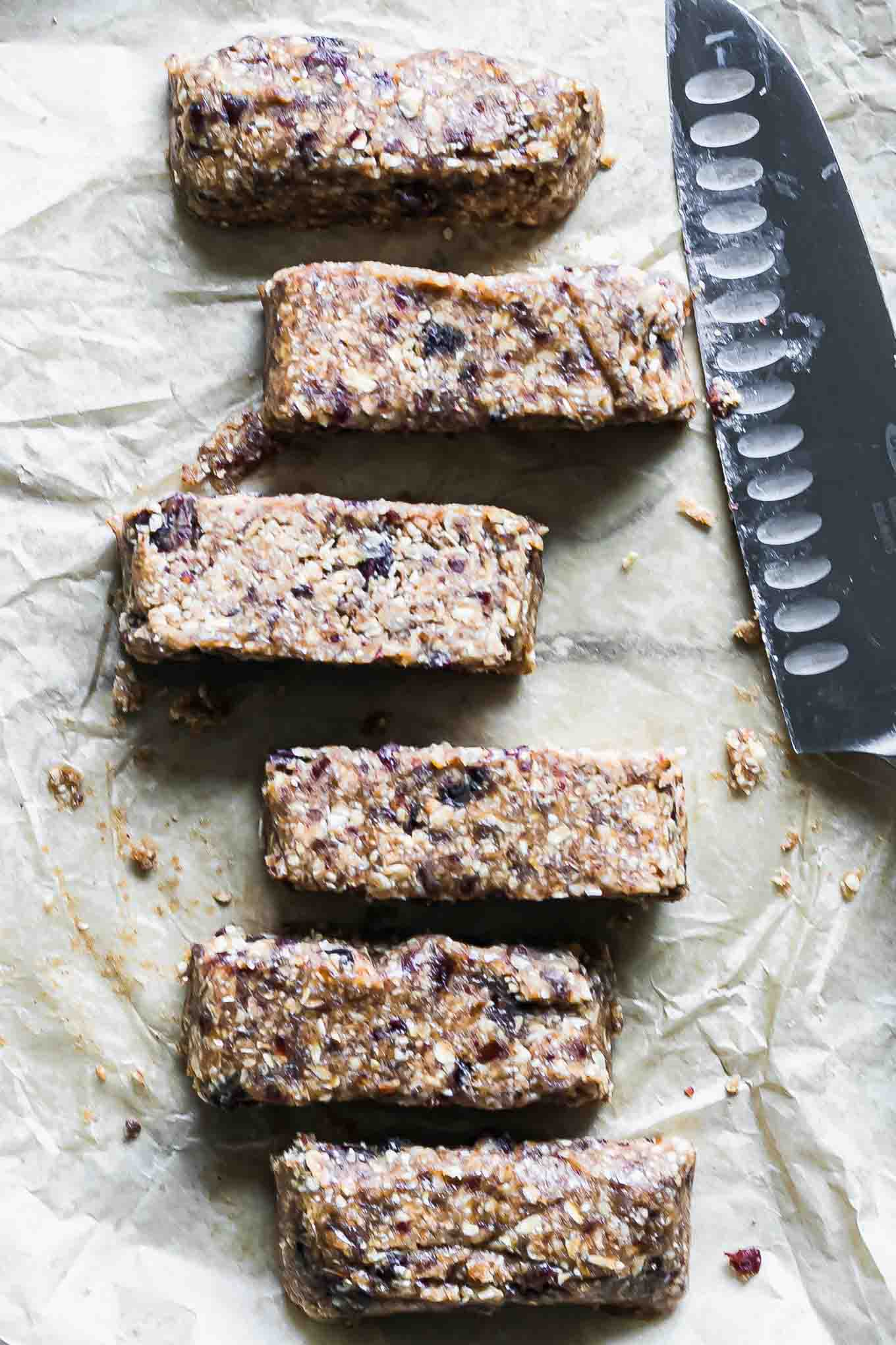 cut granola bars on a a piece of parchment paper with a knife