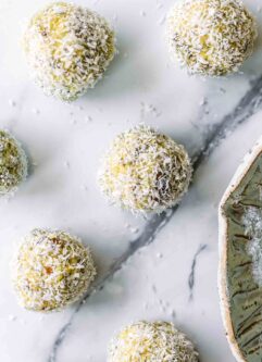small coconut lemon energy balls on a white table