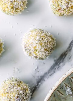lemon coconut snack balls on a white table