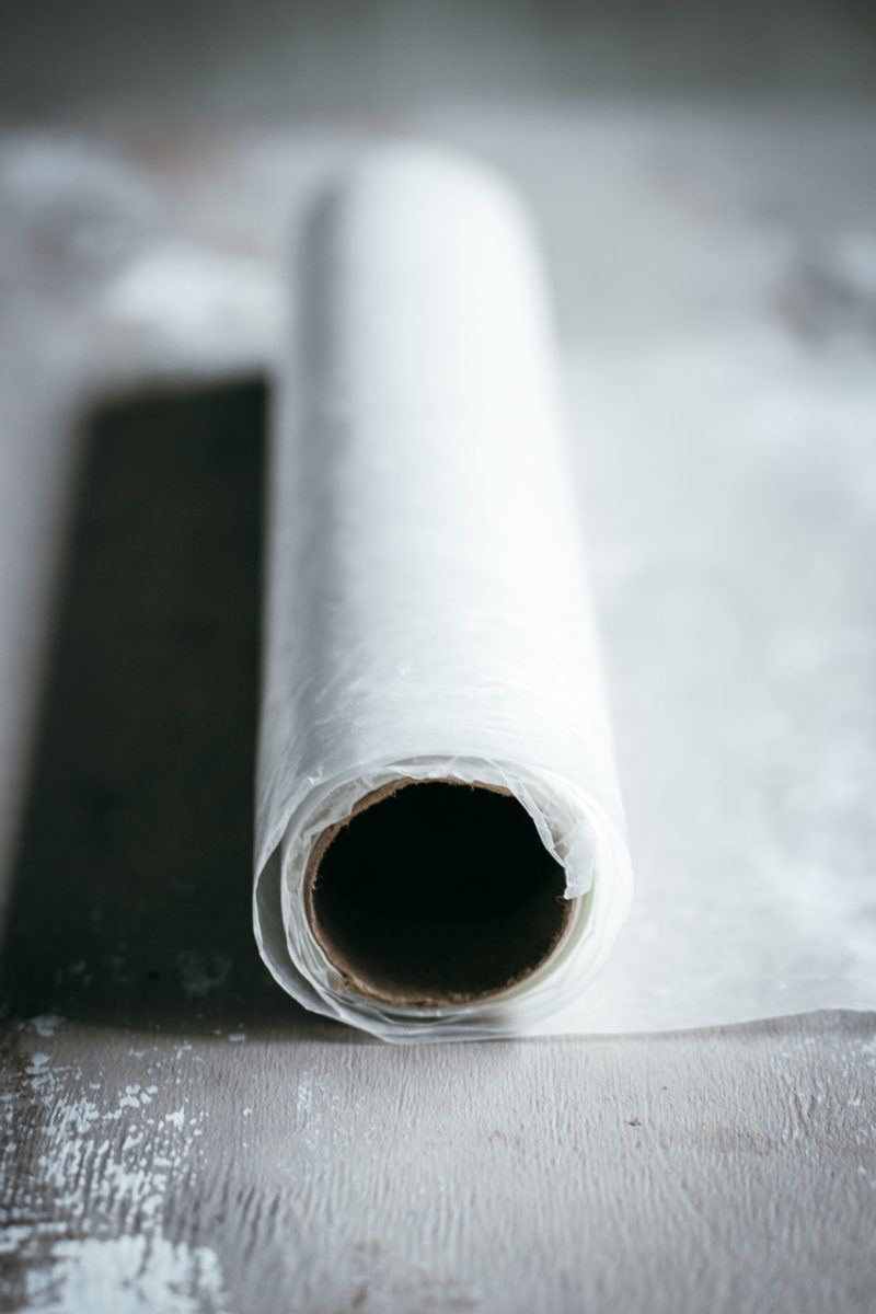 side view of a roll of wax paper on a countertop