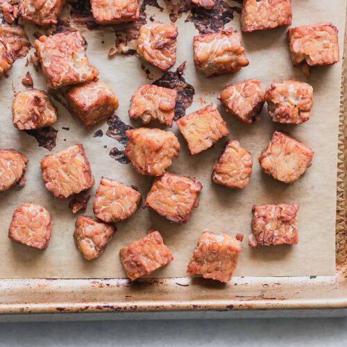 crispy tempeh on a sheet pan after baking