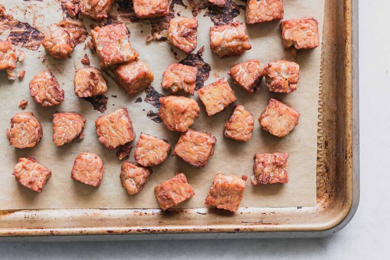 crispy tempeh on a sheet pan after baking