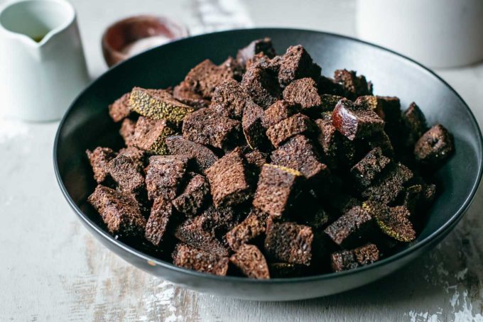 bowl of pumpernickel croutons on a counter