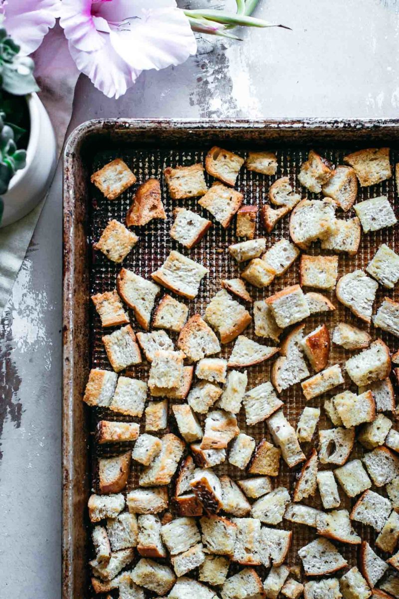 homemade rye bread croutons on a baking pan