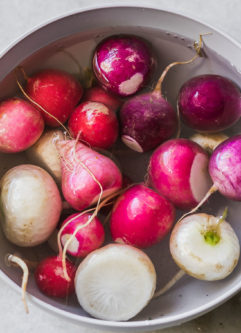 cut radishes in a bowl filled with water