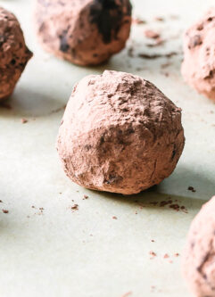 rolled brownie bite snack balls on a parchment paper