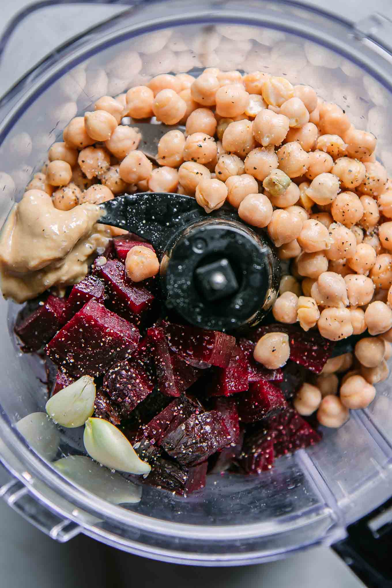 roasted beets, chickpeas, tahini, garlic, lemon juice, salt, and oil in a food processor before making hummus