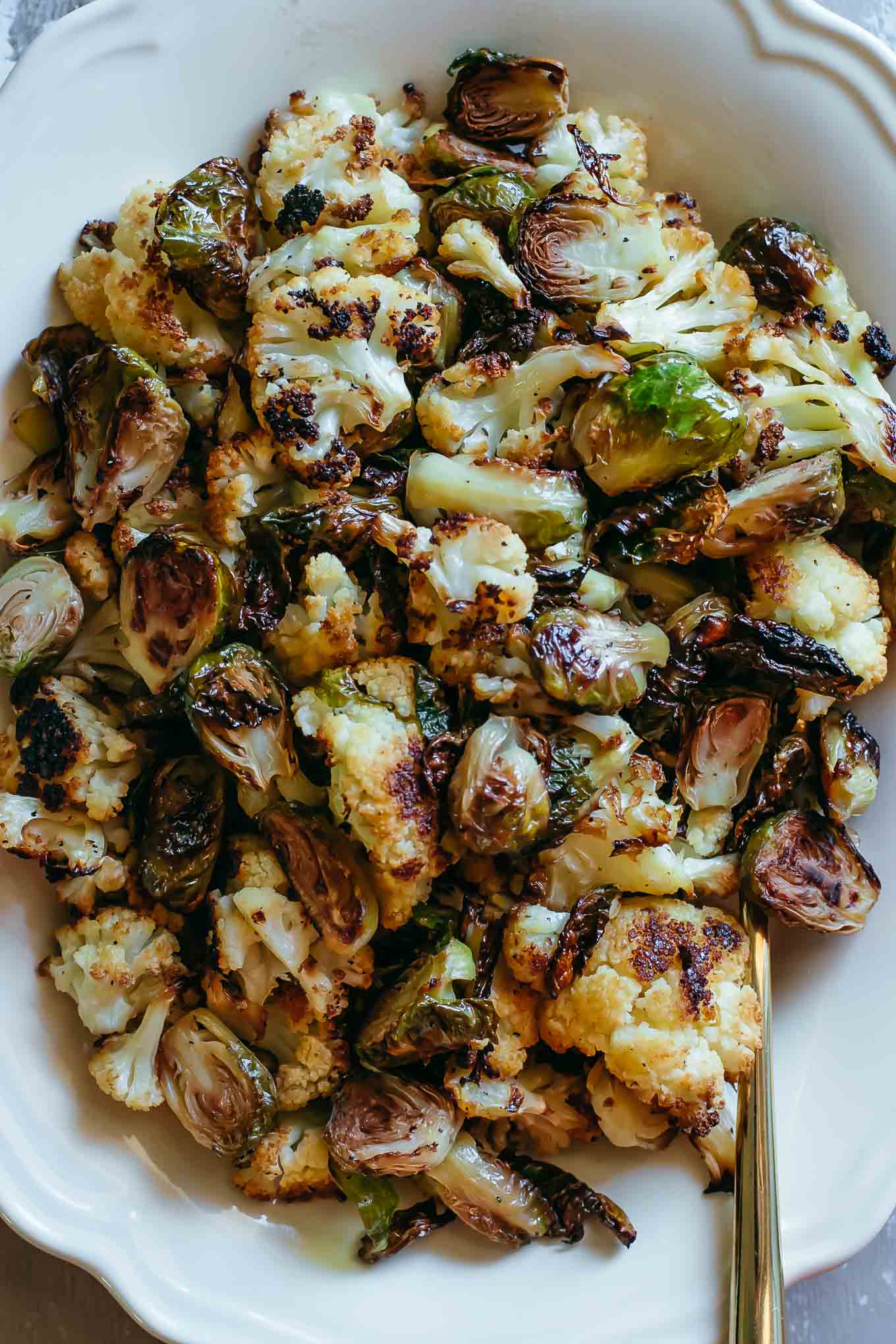 close up of oven baked brussels sprouts and cauliflower