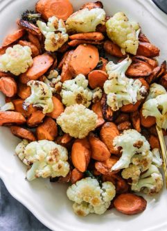 baked cauliflower and carrot side dish on a white table