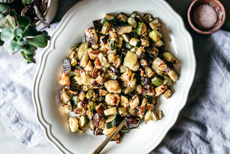 baked eggplant and zucchini on a white plate