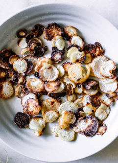 roasted turnip chips in a white bowl