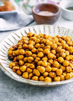 baked chickpeas in a bowl on a white table