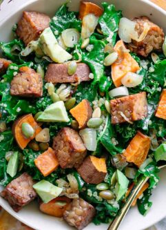 a kale and quinoa bowl with tempeh and sweet potatoes
