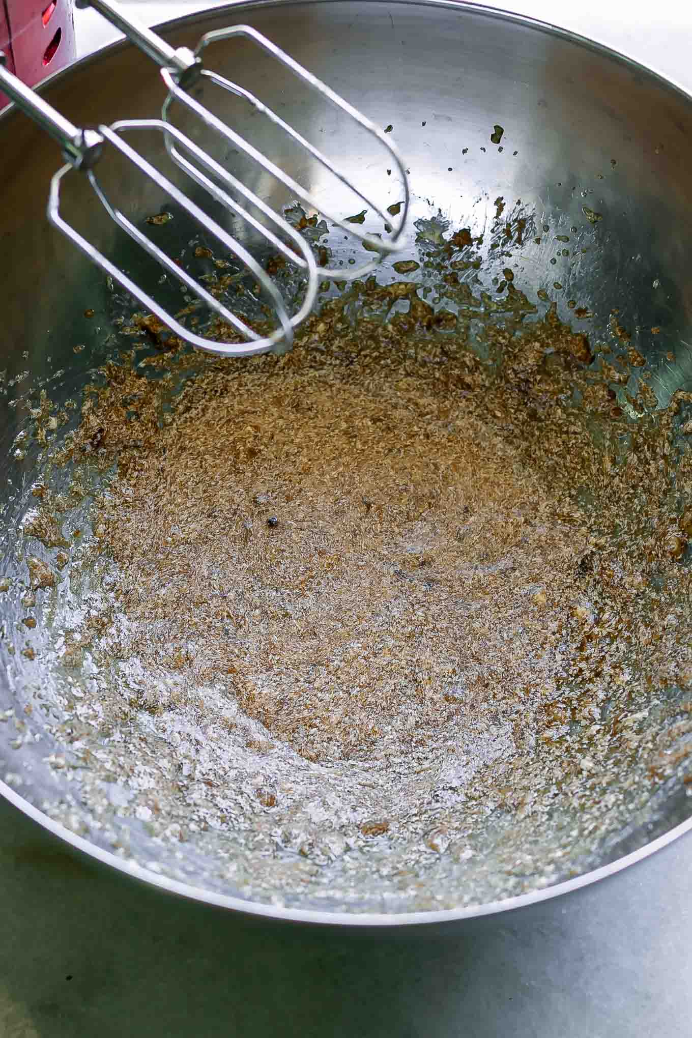a bowl of mixed banana with butter, vanilla, and sugar for oatmeal cookies