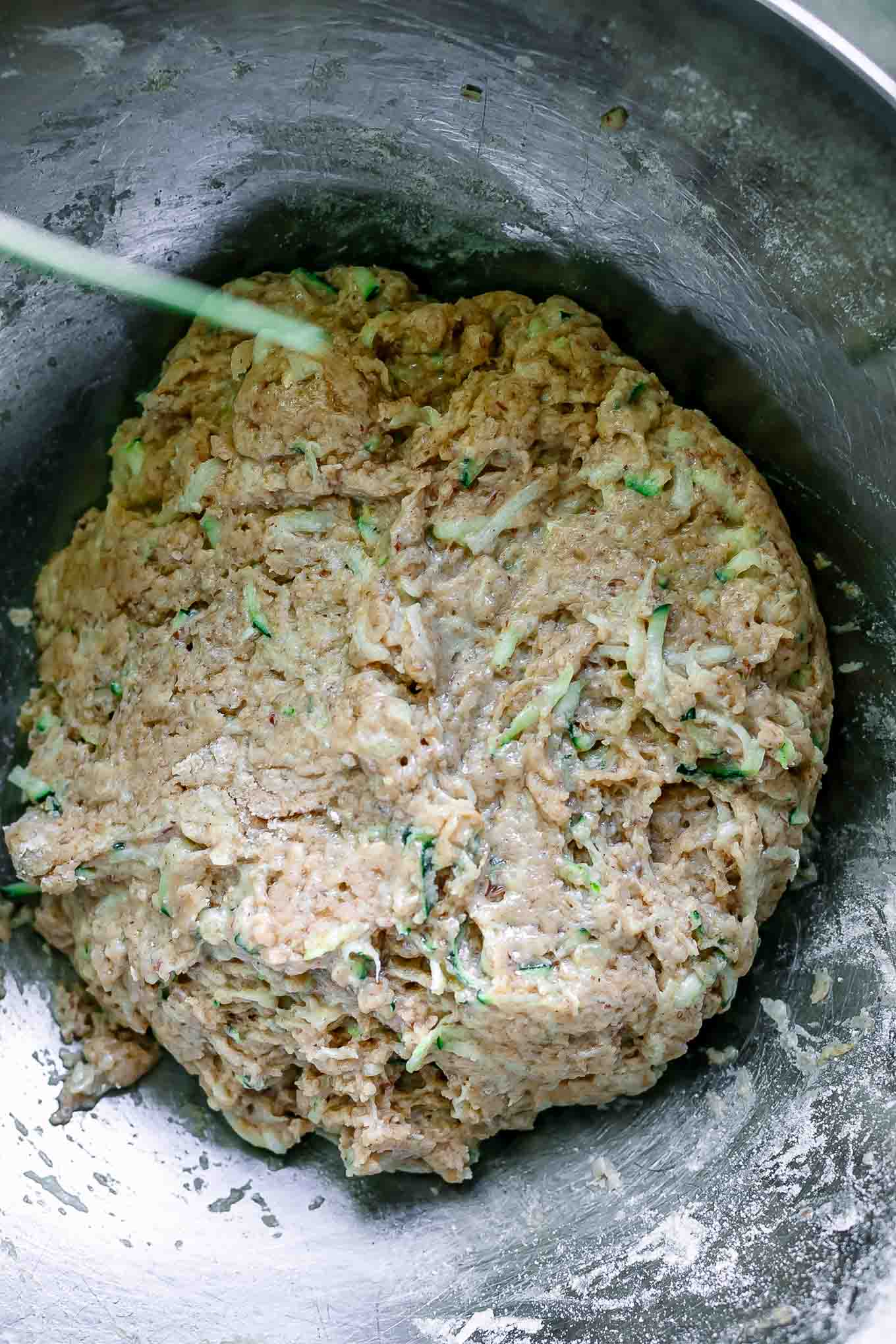 zucchini muffin batter in a mixing bowl