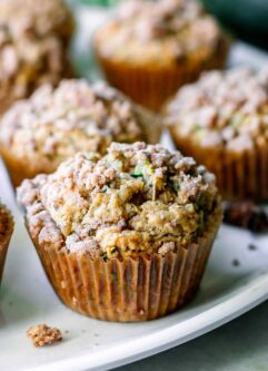 a plant-based zucchini muffin on a white table