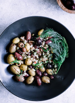A mixture of green and kalamata olives with capers and herbs.